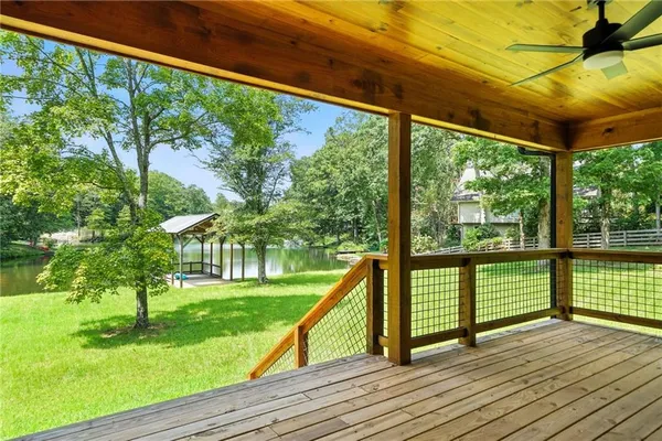 a view of outdoor space with deck and a backyard