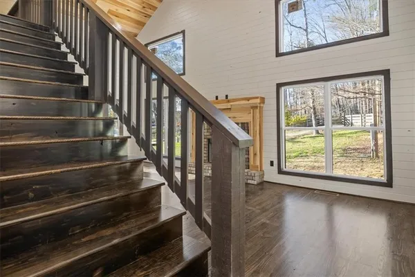 a view of entryway and hall with wooden floor
