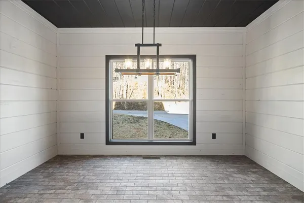 a view of an empty room and window