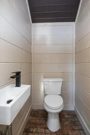 a bathroom with a toilet and a sink