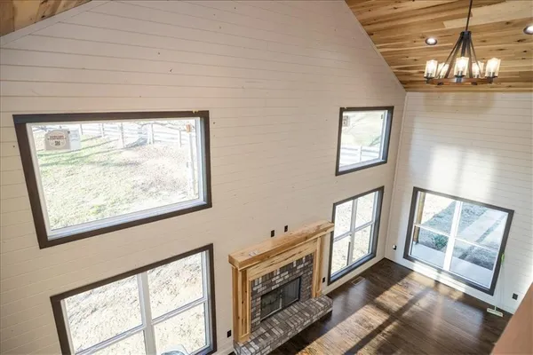 a view of an entryway with wooden floor