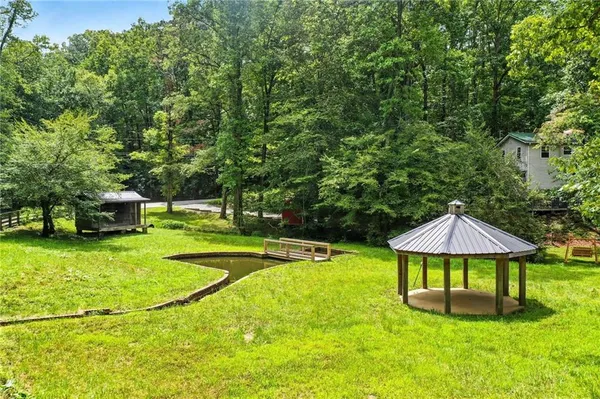 a swimming pool with yard barbeque oven and outdoor seating