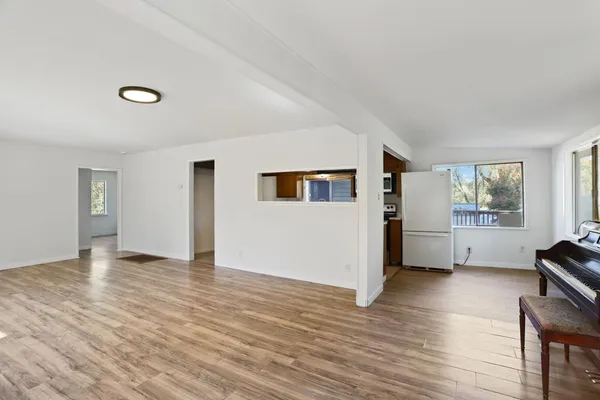 a kitchen with stainless steel appliances granite countertop a refrigerator stove top oven and sink