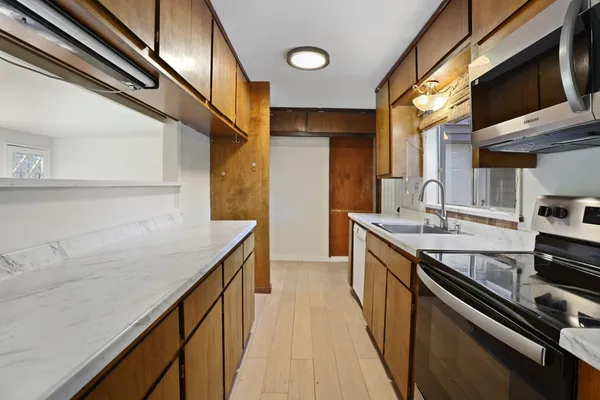 a kitchen with a sink and cabinets