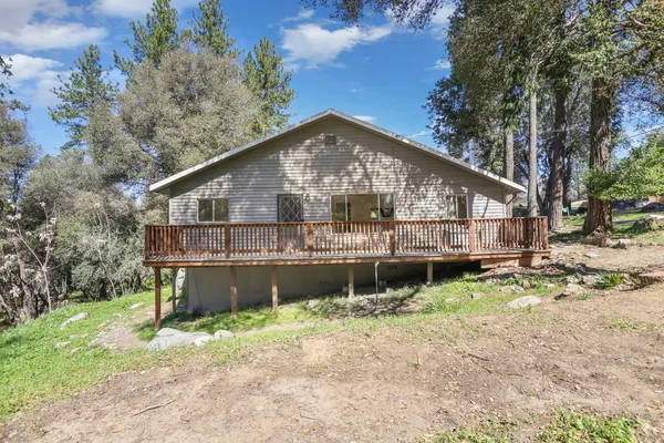 a house with trees in the background