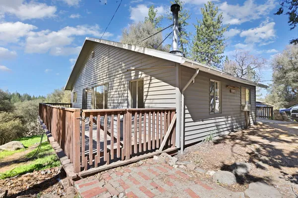 a view of balcony with wooden floor and seating space