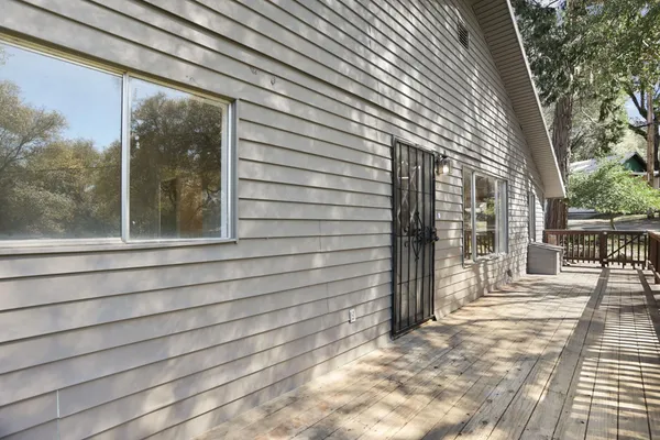 a view of an entryway with wooden floor
