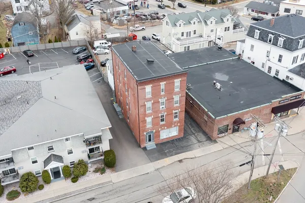 an aerial view of residential houses with outdoor space