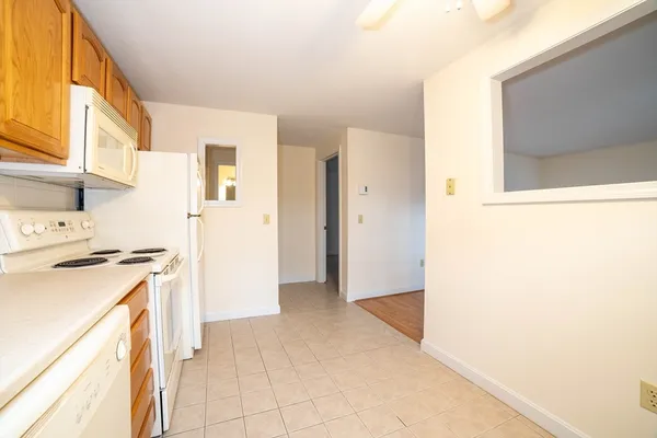 a view of a kitchen with a stove top oven