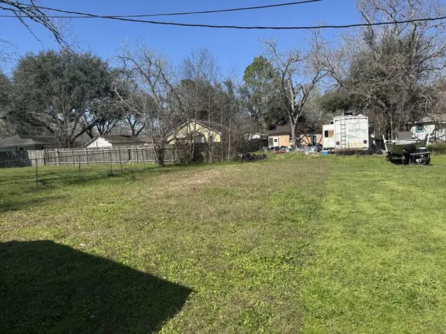 a view of a outdoor space with garden and trees