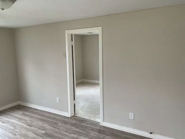 wooden floor and closet in a room