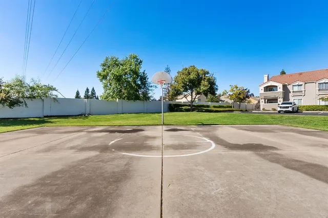 a view of a house with swimming pool and sitting area