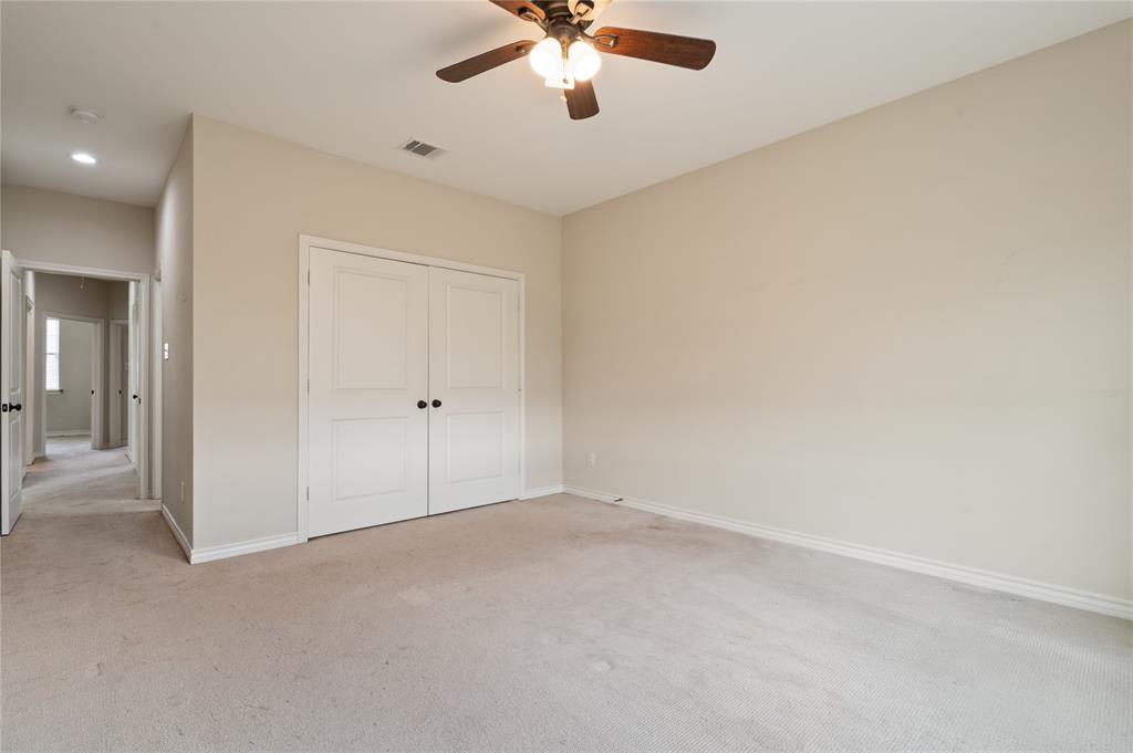104 Eagle Meadow Drive Weatherford, TX 76087 - Photo 18 of 40 an empty room with chandelier fan