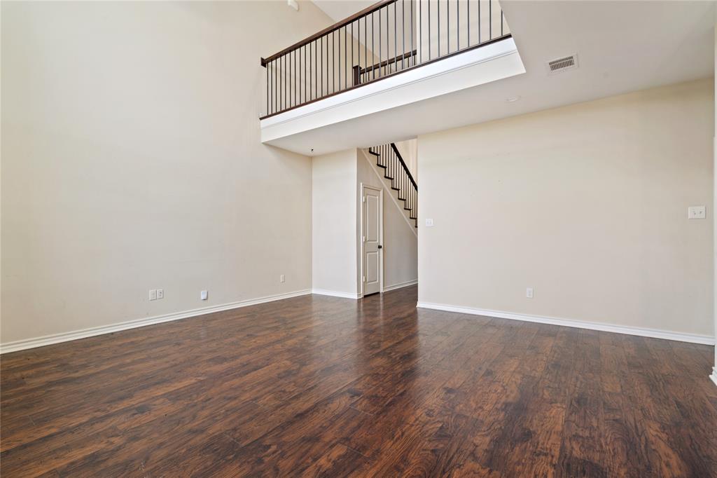 104 Eagle Meadow Drive Weatherford, TX 76087 - Photo 8 of 40 an empty room with wooden floor and windows