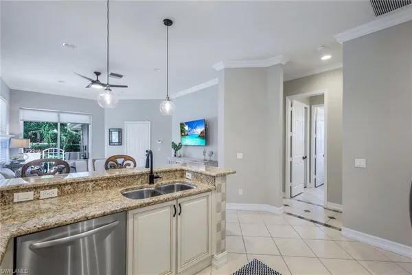 a view of a dining room with furniture wooden floor and chandelier
