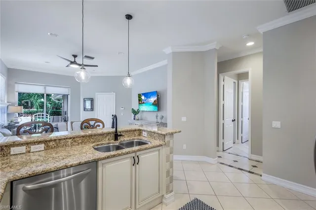 a view of a dining room with furniture wooden floor and chandelier