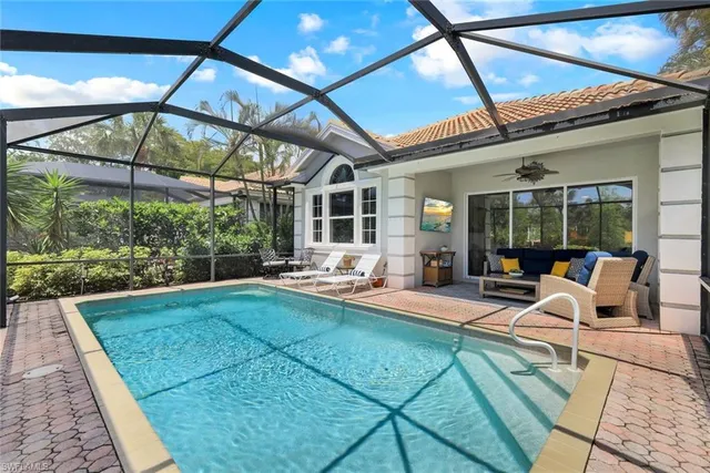 a view of a swimming pool with a patio