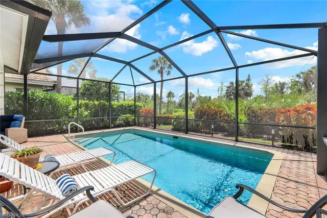 a view of a swimming pool with a patio
