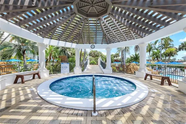a view of a lake with chairs