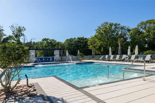 a view of a swimming pool with a patio