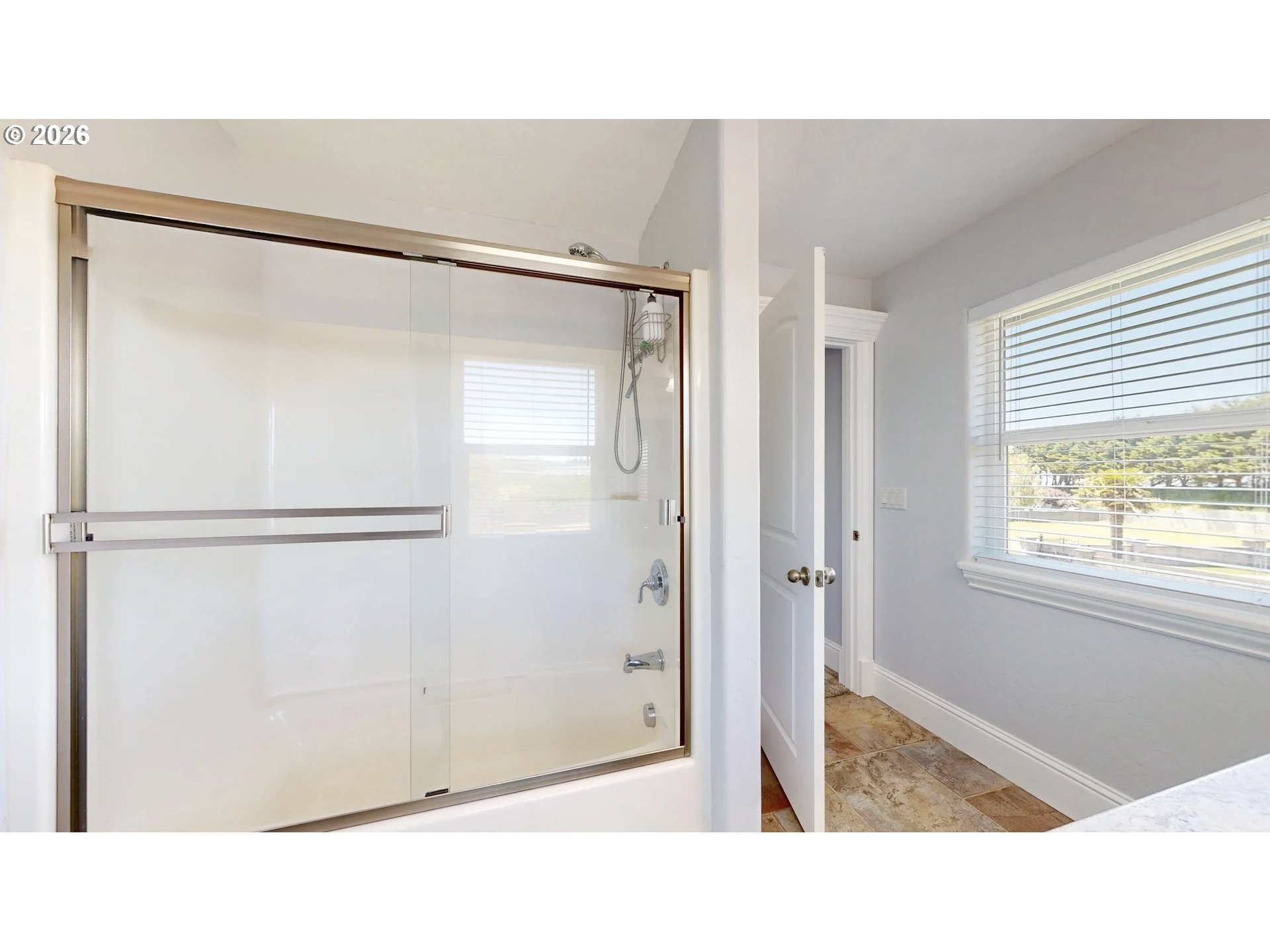 842 Chetco Point Terrace Brookings, OR 97415 - Photo 26 of 33 a bathroom with a shower and a sink