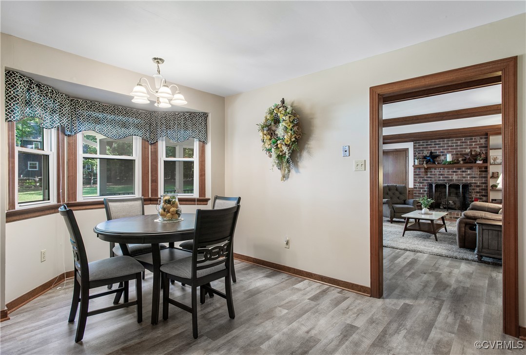 14200 Chimney House Road Midlothian, VA 23112 - Photo 16 of 44 a view of a dining room with furniture window and wooden floor