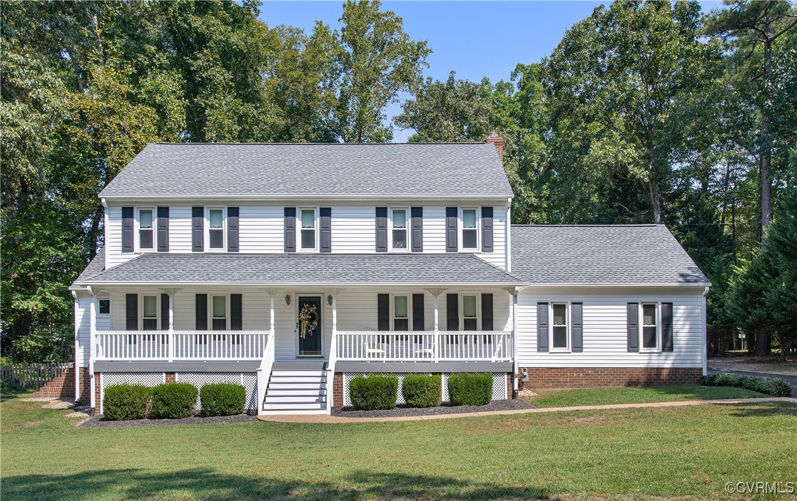 14200 Chimney House Road Midlothian, VA 23112 - Photo 2 of 44 a front view of a house with a garden