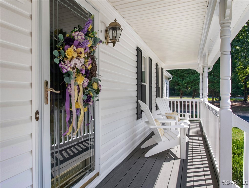14200 Chimney House Road Midlothian, VA 23112 - Photo 6 of 44 a view of a balcony with chairs and wooden floor