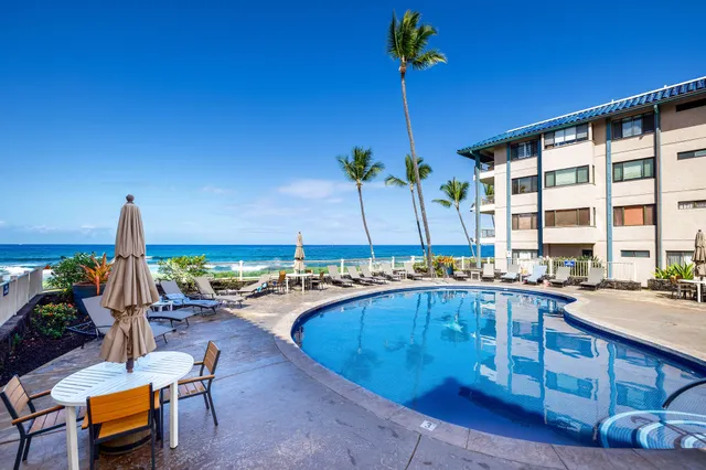 a view of a swimming pool with a lounge chairs