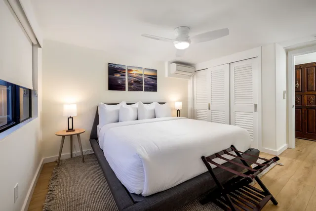 a bedroom with a bed and a couch