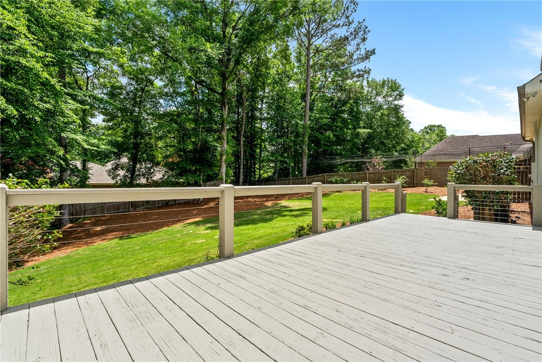 1657 Abby Road Auburn, AL 36830 - Photo 39 of 39 This spacious deck overlooks a verdant yard, offering a private outdoor retreat.