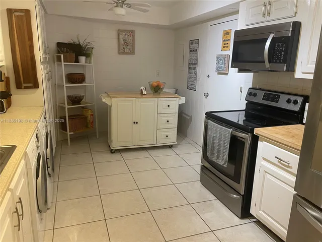 a kitchen with a stove microwave and a sink