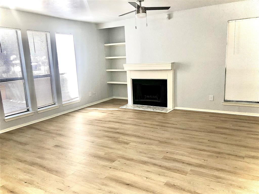 9601 Walnut Street, Unit 5101 Dallas, TX 75243 - Photo 2 of 11 a view of a livingroom with a fireplace and window