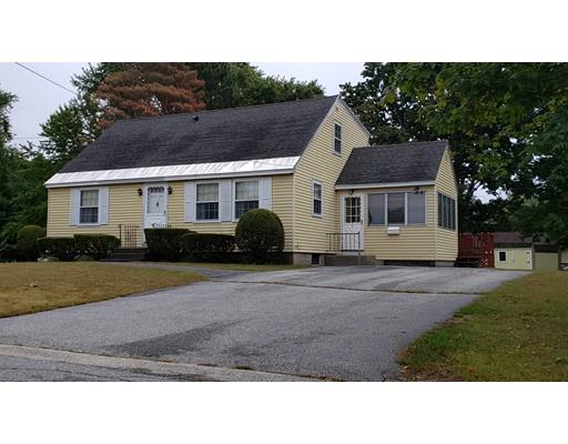 9 Claude Road Chelmsford, MA 01824 - Photo 1 of 21 a black and white house with a yard