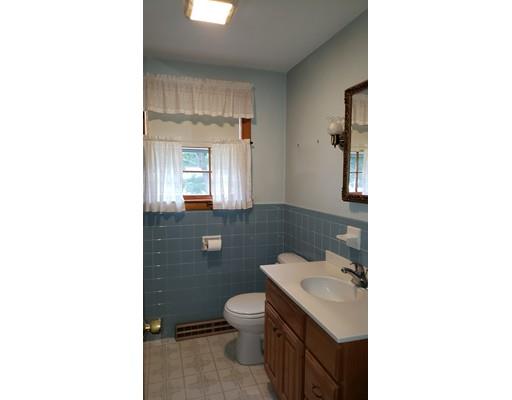 9 Claude Road Chelmsford, MA 01824 - Photo 12 of 21 a bathroom with a toilet a sink and mirror