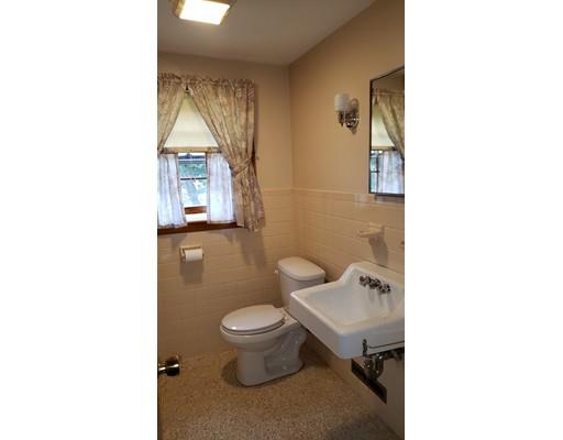 9 Claude Road Chelmsford, MA 01824 - Photo 18 of 21 a bathroom with a toilet a sink and mirror