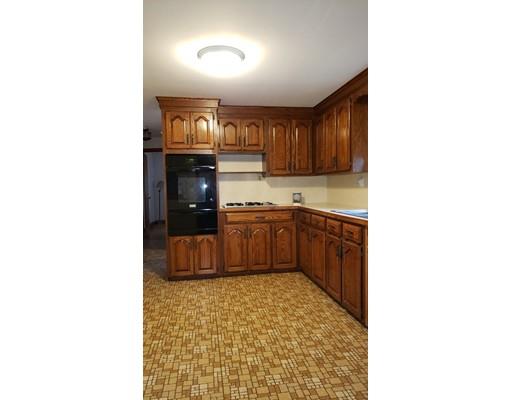 9 Claude Road Chelmsford, MA 01824 - Photo 8 of 21 a kitchen with granite countertop a refrigerator and cabinets