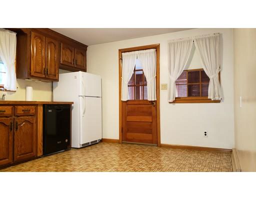 9 Claude Road Chelmsford, MA 01824 - Photo 9 of 21 a kitchen with a refrigerator and a stove