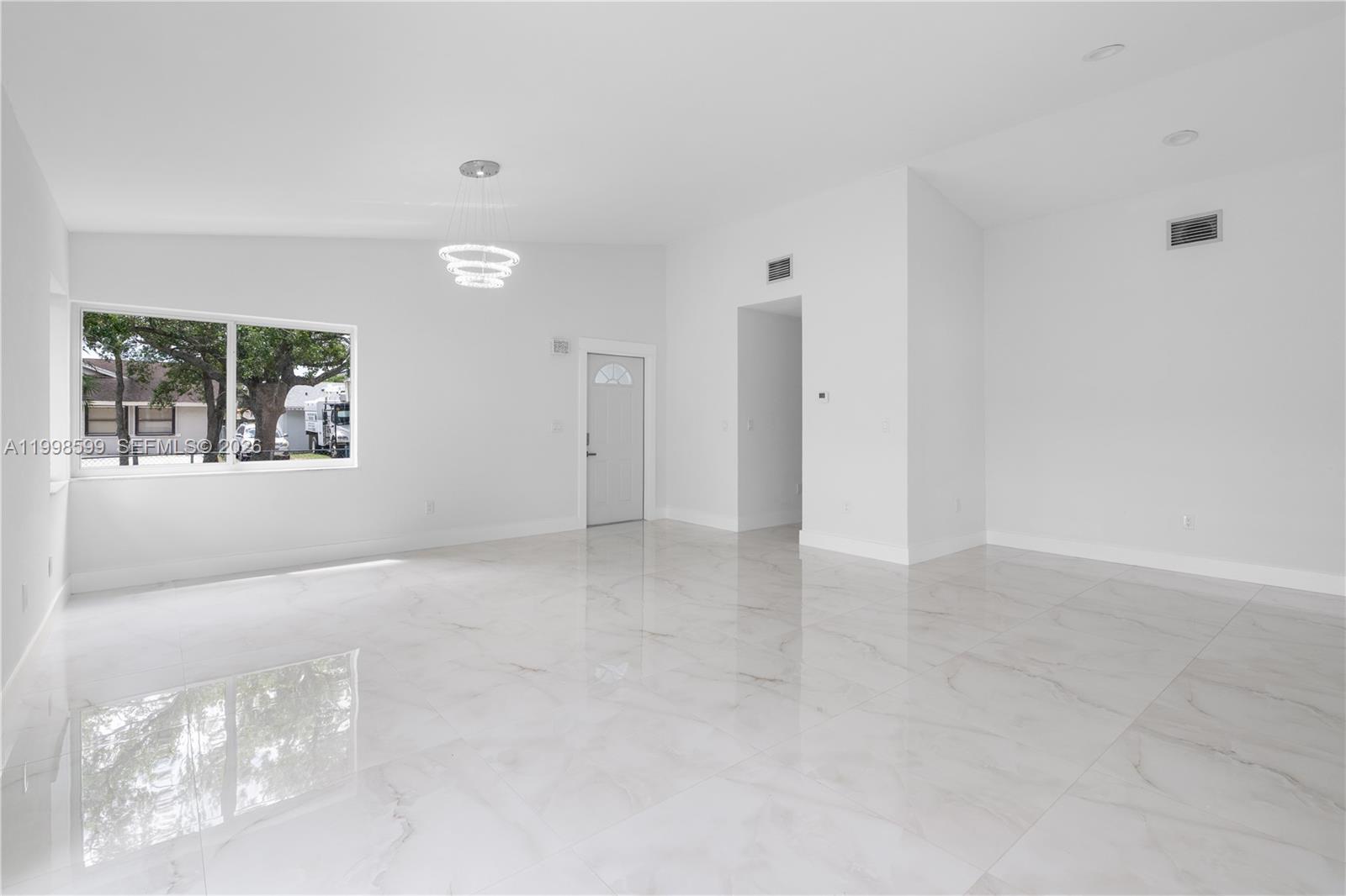 16345 Southwest 303rd Street Homestead, FL 33033 - Photo 11 of 19 a view of an empty room with a window