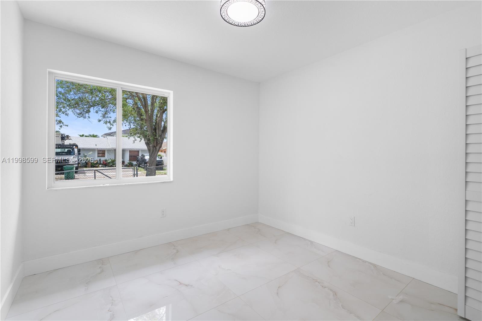 16345 Southwest 303rd Street Homestead, FL 33033 - Photo 16 of 19 a view of empty room with window