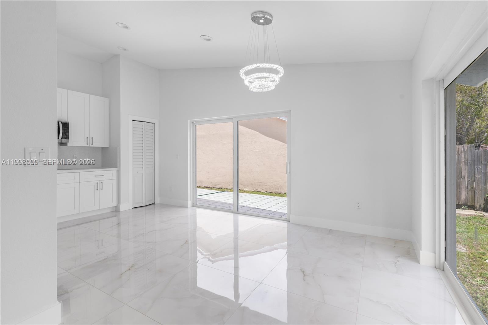 16345 Southwest 303rd Street Homestead, FL 33033 - Photo 10 of 19 a view of cabinets and window