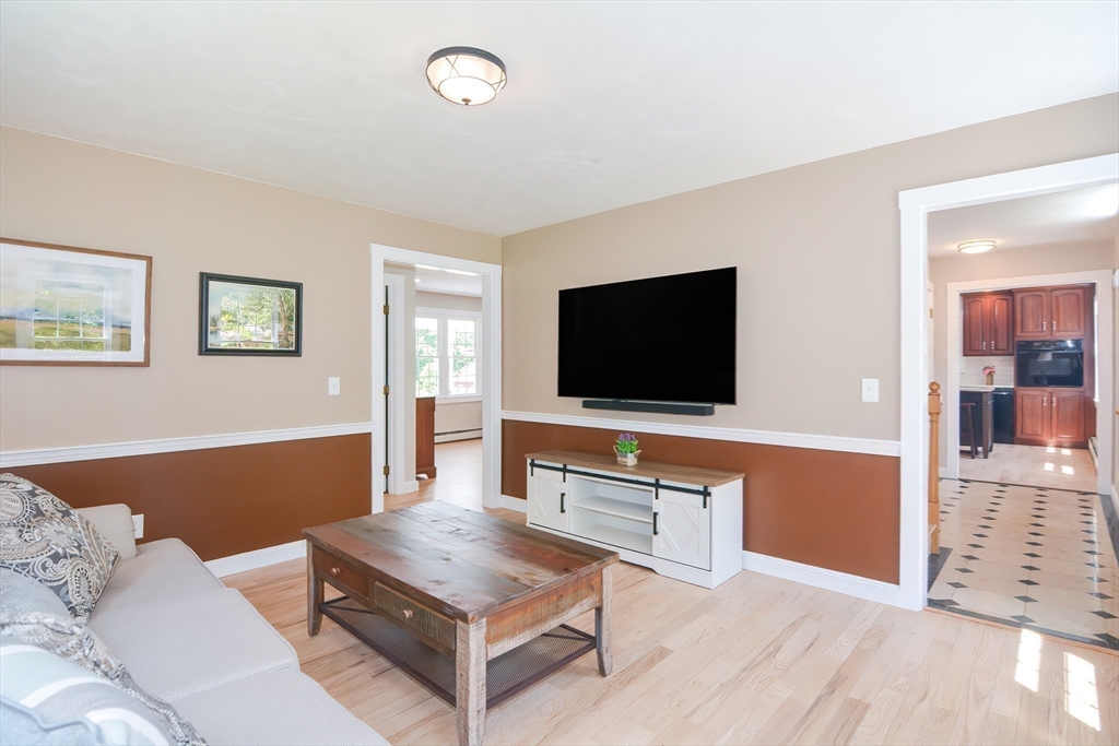 13 Park Street Mendon, MA 01756 - Photo 15 of 37 a living room with furniture and a flat screen tv