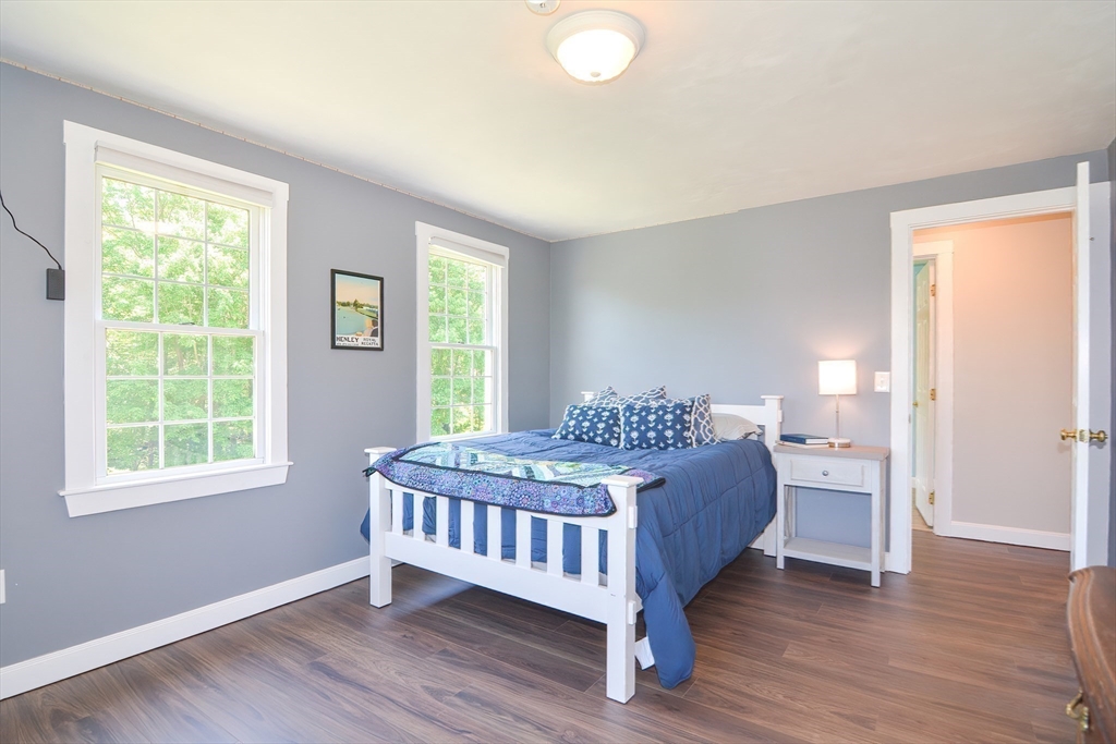 13 Park Street Mendon, MA 01756 - Photo 20 of 37 a bedroom with a bed and wooden floor