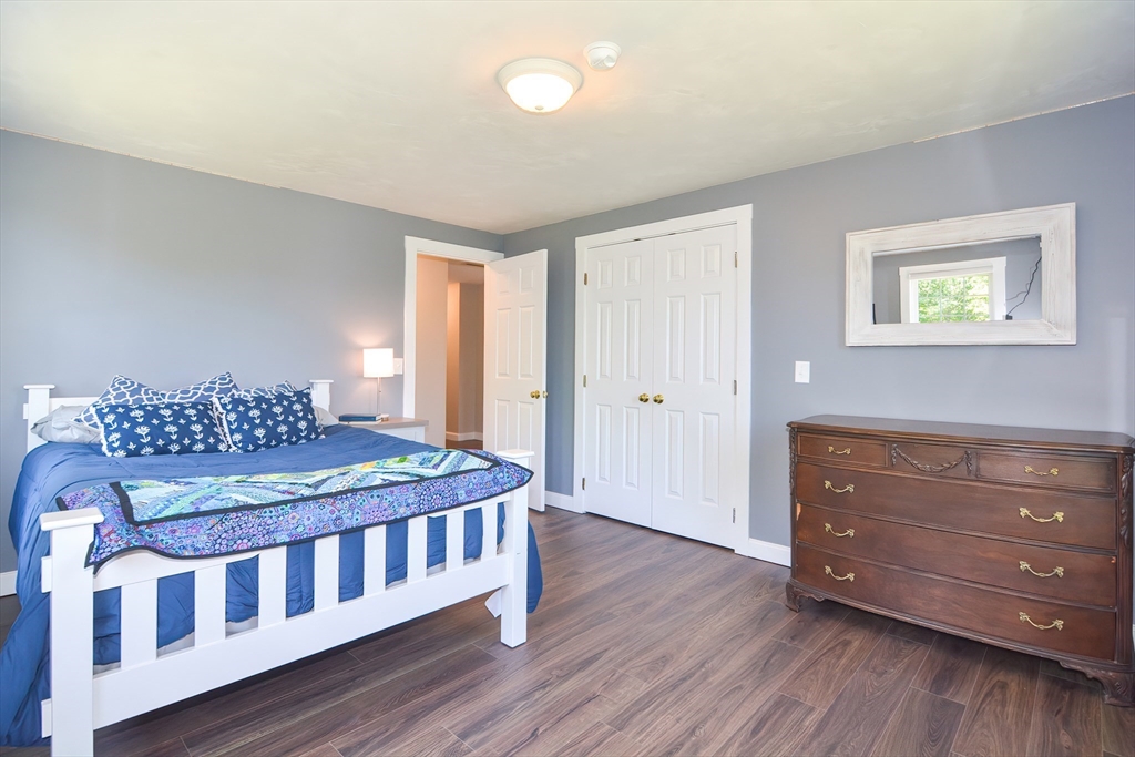 13 Park Street Mendon, MA 01756 - Photo 21 of 37 a bedroom with a bed and wooden floor