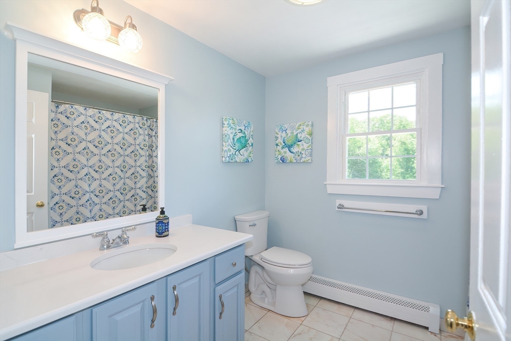13 Park Street Mendon, MA 01756 - Photo 25 of 37 a white toilet sitting next to a bathroom sink