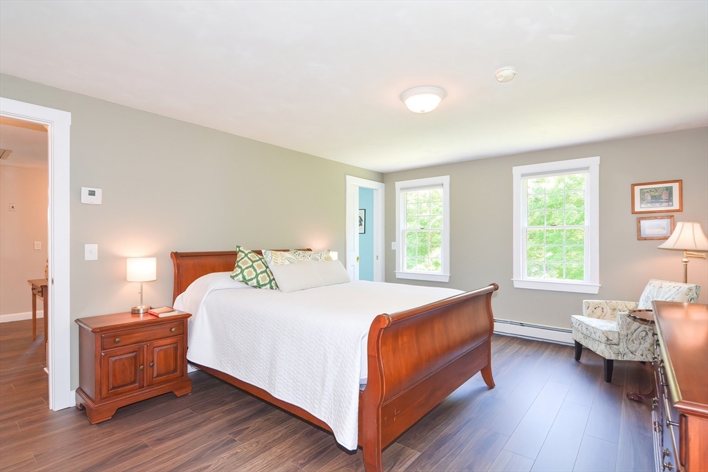 13 Park Street Mendon, MA 01756 - Photo 26 of 37 a bedroom with a bed and wooden floor