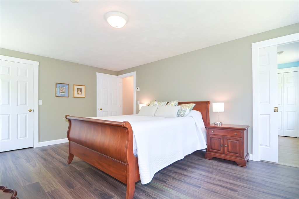 13 Park Street Mendon, MA 01756 - Photo 27 of 37 a bedroom with a bed and wooden floor