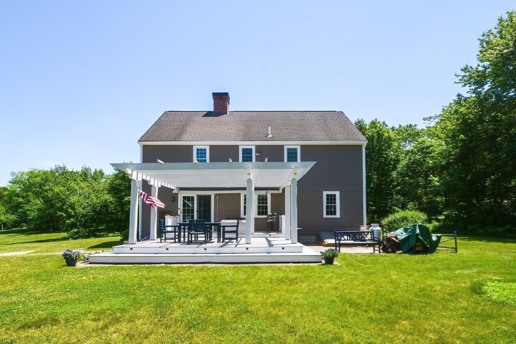 13 Park Street Mendon, MA 01756 - Photo 31 of 37 a front view of a house with swimming pool and porch with furniture