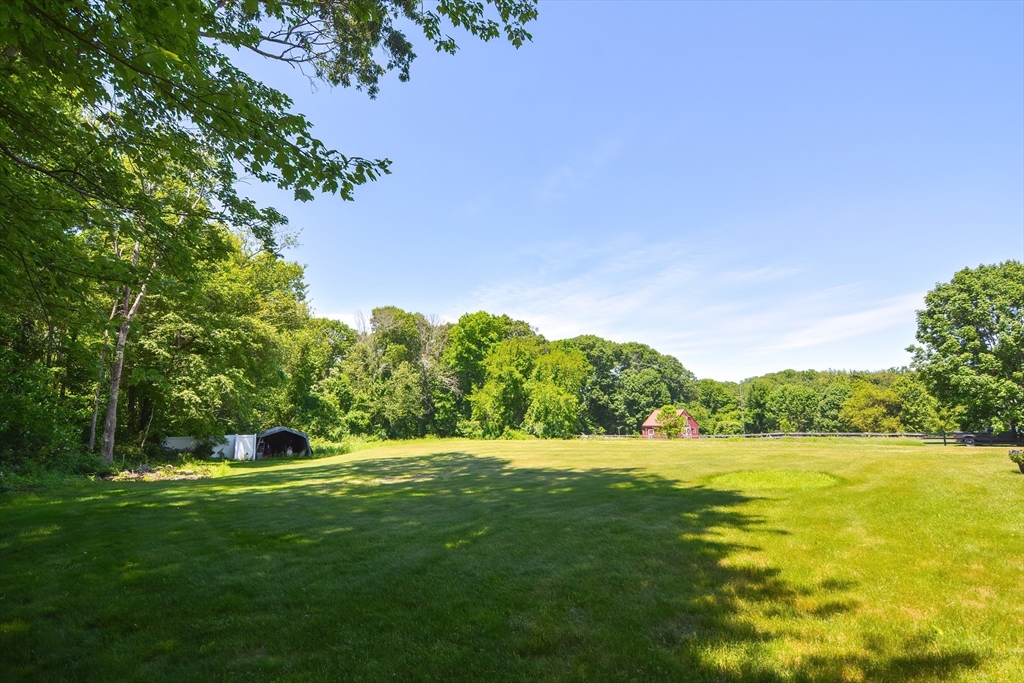 13 Park Street Mendon, MA 01756 - Photo 35 of 37 a view of green field with trees in the background