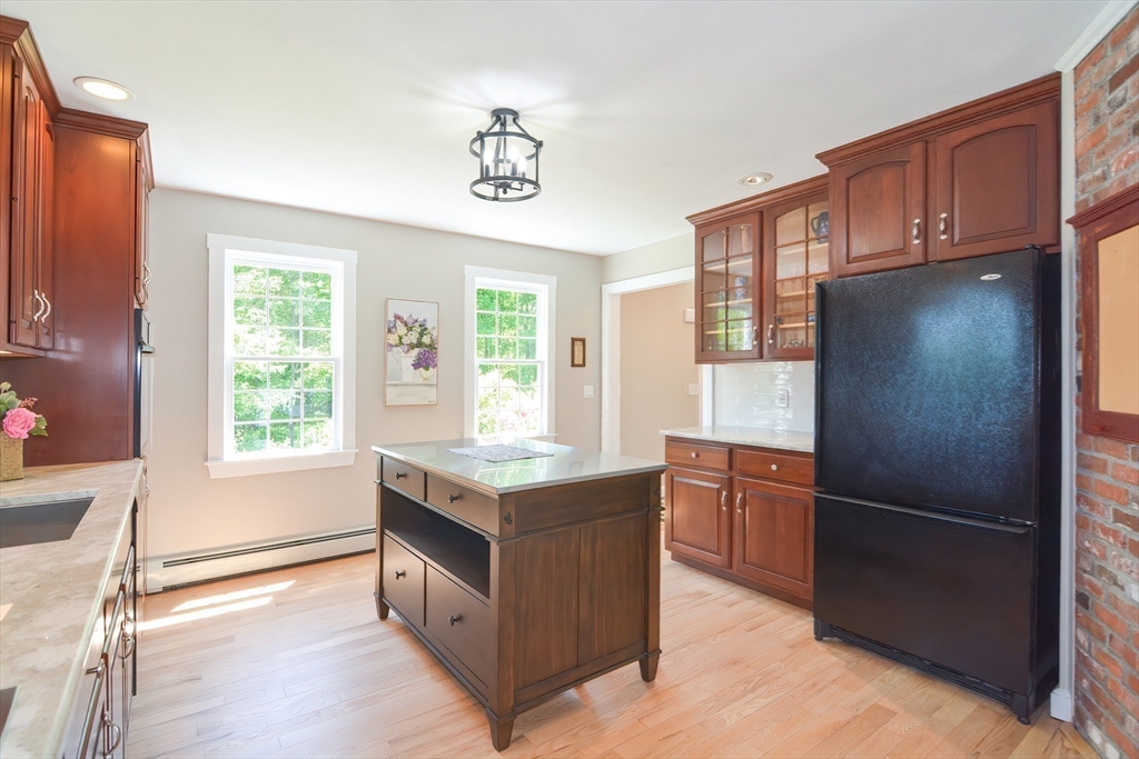 13 Park Street Mendon, MA 01756 - Photo 5 of 37 a kitchen with stainless steel appliances granite countertop a refrigerator and a sink